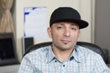 Man in Plaid and Hat