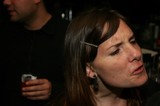 Contemplative Woman at a Dimly Lit Party
