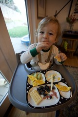 Toddler Enjoying Healthy Snack Time at Home