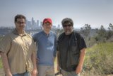 Three Men Enjoying a Sunny Day Outdoors