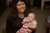 Mother's Joy: Tender Moment with Newborn Baby