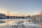 Serene Waters with Industrial Power Lines
