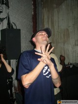 Tattooed Entertainer Gesturing with Style