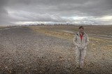 Solitary Figure in a Vast Desert Wilderness