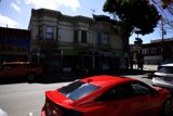 Vibrant Red Car in the Urban Landscape