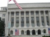 The Majestic Office Building with Flags