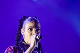 FKA twigs Incredible Close-Up Portrait Face Visible Baby Hairs Elaborate Swirls Spirals Cat-Eye Makeup Hoop Earrings Black Choker Braided Ponytails Kimono Purple Blue Lighting