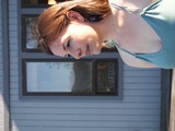 Sunlit Portrait of Redhead Woman in Teal Dress
