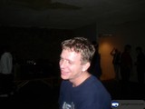 Smiling Man in Blue T-Shirt