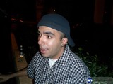 Urban Portraits: Man in Plaid Shirt and Hat