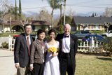 Wedding Party Poses in Front of Vintage Cars
