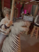 Motion Blur Child on Merry-Go-Round at Night