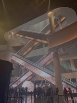 Futuristic Museum Interior with Crowd