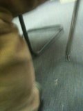 Blurry Seated Figure