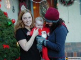 Festive Family Portrait in Front of Christmas Tree