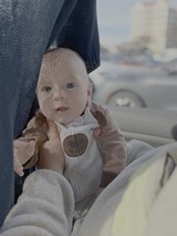 Baby in Car Seat with Dappled Light
