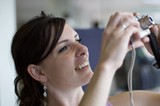 Joyful Woman Captures a Moment with Camera