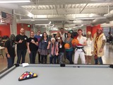 Office Halloween Costume Party Around Pool Table