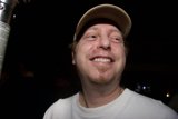 Smiling Randy J in White Cap
