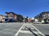 Busy City Street with Parked Cars