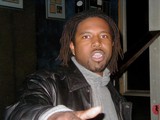 Dreadlocked Man in Artful Jacket