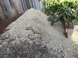 Fresh Gravel Pile in Residential Backyard Construction