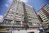Tall Urban Apartment Building with Fire Escape
