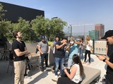Rooftop Gathering During Solar Eclipse Viewing