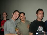 Group of Four Men With Drinks and Accessories