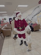 Santa Claus Visits Shopping Mall at Christmas