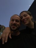 Smiling Couple under a Blue Sky