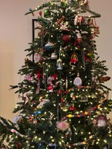 Festively Decorated Christmas Tree with Eclectic Ornament Collection