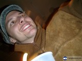 Happy Man in a Hat with a Cup