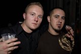 Two Men Cheersing at a Party