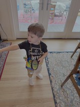Young Child Playing Indoors with Toy
