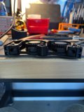 Wooden clamp holding computer hardware