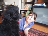 Woman and Her Black Dog Share a Playful Moment