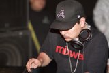 Party DJ Craze Rocks a Baseball Hat and Headphones
