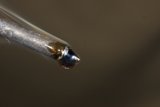 Magnified Metal Object with a Small Hole