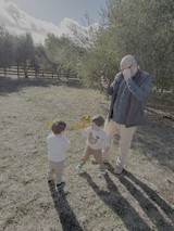 Father and Children Playing in Countryside Field