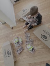 Child Unpacking Broadleaf Food Delivery Box