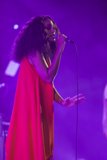 Solange Profile Expressive Hand Extended Red Dress Purple Haze