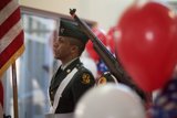 Saluting the flag with balloons