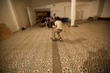 Skateboarder on Tiled Floor