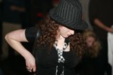 Chic Woman in Sun Hat and Black Shirt