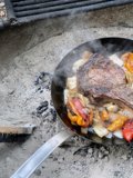 Flame-kissed steak on the grill