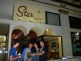 People Gather Outside Star Shoes Store