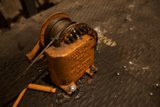 Rusty winch and worn-out rope