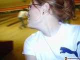 Red-haired Woman with Glasses and Earrings