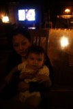 Mother and Child in a Cozy Room Filled with Technology